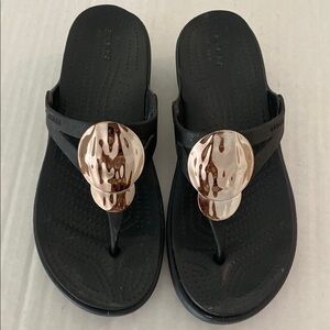 CROCS : Black and Gold Sandals Sleek Casual Style